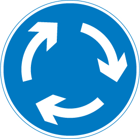 The instructional road signs telling drivers to treat the next piece of road as a roundabout. 